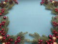 Christmas light blue background with fir and ornaments decor