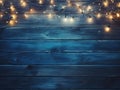 Christmas Light on Blue Wooden Background Top View with Copyspace. Garland Lights on Vintage Wood Royalty Free Stock Photo