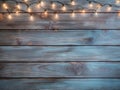 Christmas Light on Blue Wooden Background Top View with Copyspace. Garland Lights on Vintage Wood Royalty Free Stock Photo