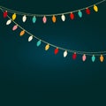 Christmas light bulb garland with multicolored rainbow lights on dark navy background. New Year card banner template Royalty Free Stock Photo