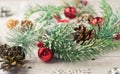 Christmas light gray background on whitewashed wooden boards with green spruce wreath, toys, silver snowflakes and gifts Royalty Free Stock Photo
