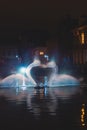 Christmas light show in the form of the Swan Dance on the water canal in the historic district in Bruges, Belgium. Romantic scene Royalty Free Stock Photo