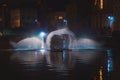 Christmas light show in the form of the Swan Dance on the water canal in the historic district in Bruges, Belgium. Romantic scene Royalty Free Stock Photo