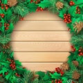 Christmas light wooden background with holly berries, pine branches and cones. Royalty Free Stock Photo