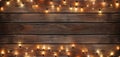 Christmas Light on Wooden Background Top View with Copyspace. Garland Lights on Vintage Wood Texture Royalty Free Stock Photo