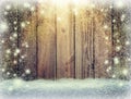 Glow of festive lights and a wooden background in the snow. Chr Royalty Free Stock Photo