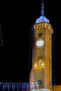 Christmas lights on ancient clock tower Royalty Free Stock Photo