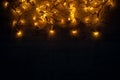 Christmas lights background concept on wooden desk. Royalty Free Stock Photo