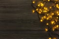 Christmas lights border on grey wooden background Royalty Free Stock Photo