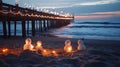 Christmas lights on beach pier, sand snowmen, ocean waves . Royalty Free Stock Photo
