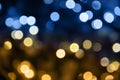 Christmas lights. Bokeh glows on a dark background. Christmas garlands with a blurred focus in the form of gold and blue bokeh Royalty Free Stock Photo