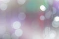 Christmas lights bokeh on transparent background. Xmas glowing garland. Blurred colorful light, violet, purple, green, white in Royalty Free Stock Photo