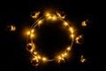 Christmas lights border. Golden light garland decoration, gold bulb isolated on black for xmas party ornament decor Royalty Free Stock Photo