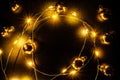 Christmas lights border. Golden light garland decoration, gold bulb isolated on black for xmas party ornament decor Royalty Free Stock Photo