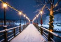 Christmas Lights On A Bridge, With A View Of A Snowy Riverbank. Generative AI Royalty Free Stock Photo