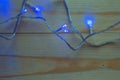 Christmas lights bulb decoration on old wood plank. Royalty Free Stock Photo