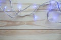 Christmas lights bulb decoration on old wood plank. Royalty Free Stock Photo