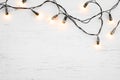 Christmas lights bulb decoration on white wood. Royalty Free Stock Photo
