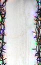 Christmas lights bulb frame decoration on white wood Royalty Free Stock Photo