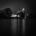 Christmas lights of a church reflected in a lake  in the dark Royalty Free Stock Photo