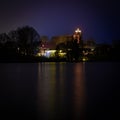 Christmas lights of a church reflected in a lake  in the dark Royalty Free Stock Photo