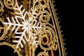 Christmas lights close up view ob black background. Light decoration with snowflakes, ornaments Royalty Free Stock Photo