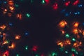 Christmas lights on dark background. Decorative garland. Tinted photo