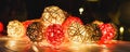 Christmas lights on dark wooden background with reflections. Christmas and New Year holidays