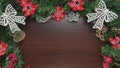 Christmas lights and decor on fir with dark wooden background