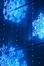 Christmas lights decoration on a building facade in blue tone