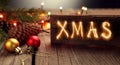 Christmas lights and decoration with sparkler Xmas inscription Royalty Free Stock Photo