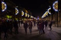 Christmas lights decoration at street of Seville and lots of people walking during the Christmas days. Royalty Free Stock Photo