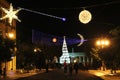 Christmas lights and decorations in night city. Christmas tree, stars garlands, installations. Royalty Free Stock Photo