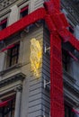 Christmas lights decorations of red ribbon and panther on the Cartier store on Fifth Avenue in Manhattan New York, USA Royalty Free Stock Photo