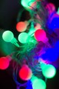 Christmas lights in different colors close up