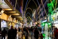 Christmas lights on the famous Preciados street in Madrid, Spain with a crowd walking and shopping