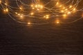 Christmas lights frame decoration on dark wood with copy space. Merry Christmas and New Year holiday background Royalty Free Stock Photo