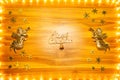 Christmas lights frame on golden wood background with copy space Royalty Free Stock Photo