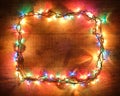 Christmas lights frame. New Year festive decorations with frame of colorful glowing Christmas lights. Colorful garland Royalty Free Stock Photo