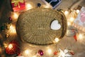 Christmas lights and garland in wooden basket. Winter season and New Year background. Celebration holidays. Presents, gifts,