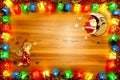 Christmas lights gift box frame,santa and angel on golden wood b Royalty Free Stock Photo