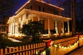 Christmas lights and holly decorate a Victorian Home