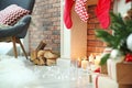 Christmas lights near fireplace with candles