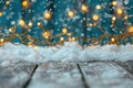 christmas lights over snow on wooden background Royalty Free Stock Photo