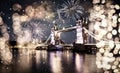 christmas lights and snow in London Tower bridge at night Royalty Free Stock Photo