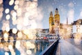 christmas lights and snow in Zurich city center with famous Grossmunster Churches and river Limmat at Lake Zurich, Canton of Royalty Free Stock Photo