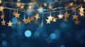 Christmas lights. Stars string in abstract defocused background. Royalty Free Stock Photo