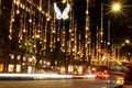 Christmas lights and traffic are seen at night in the city downtown in the Passeig de Gracia main street in Barcelona, Spain on No Royalty Free Stock Photo