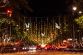 Christmas lights and traffic are seen at night in the city downtown in the Passeig de Gracia main street in Barcelona, Spain on No Royalty Free Stock Photo