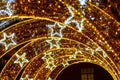 Christmas lights tunnel with stars in park Royalty Free Stock Photo